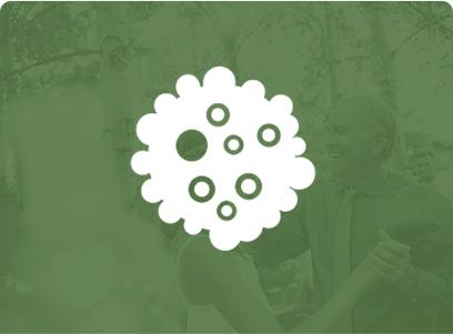 Icon of a cluster of cells with a blurred background.