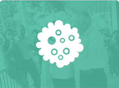 Icon of a cluster of cells with a blurred background.